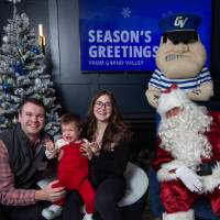 Parents with son crying with Santa and Louie